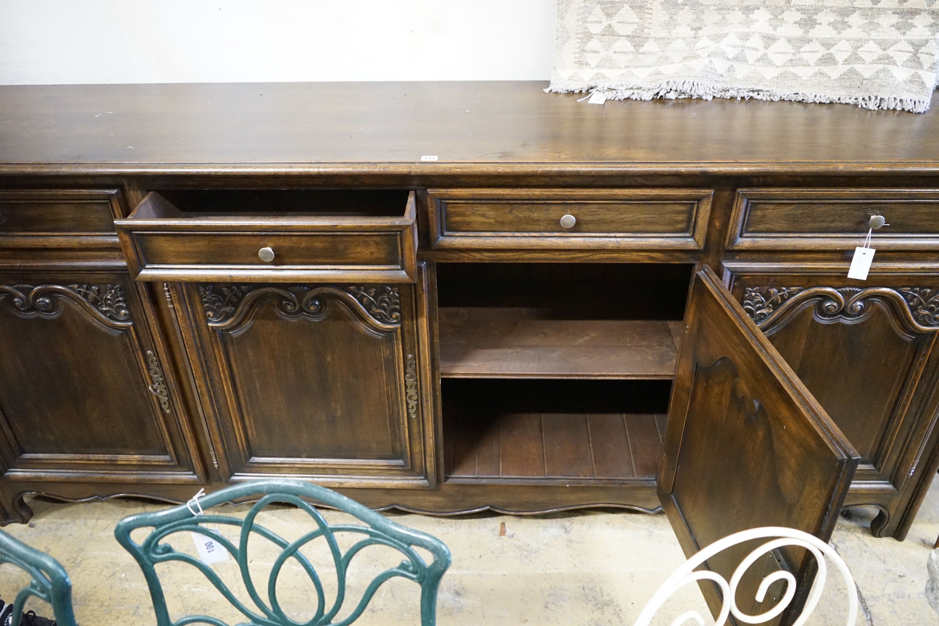 An 18th century style French oak four door buffet, length 260cm, depth 52cm, height 110cm